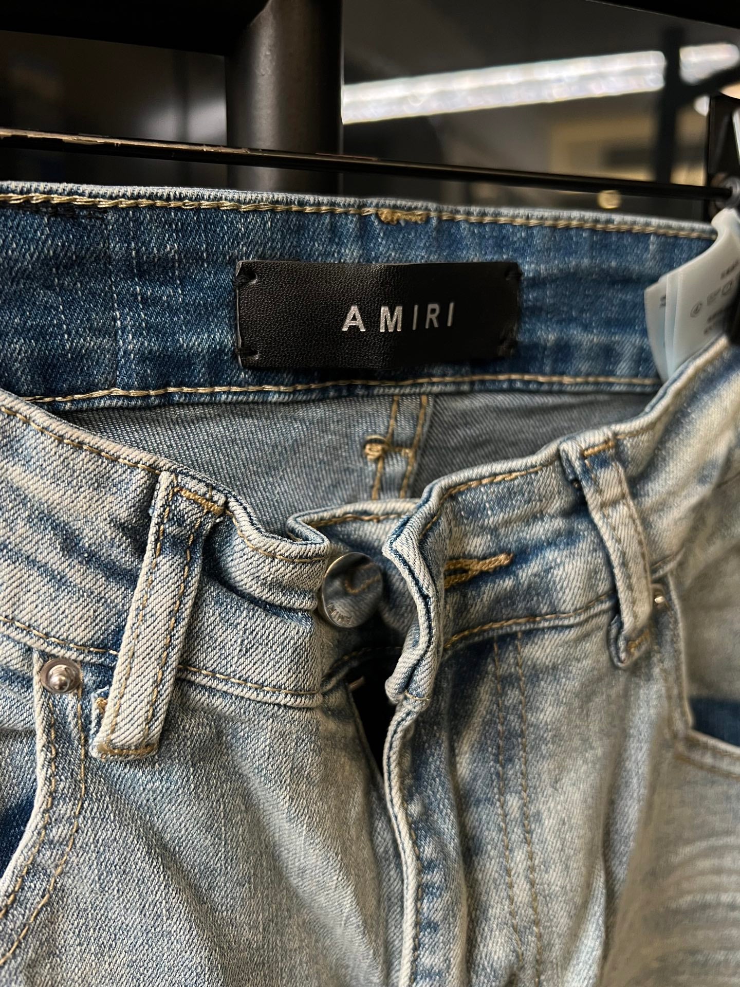 Amiri light-wash jeans waistband with lace-up detail and belt loops