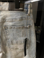 Amiri light-wash jeans with front patch pocket and stitched coin pocket