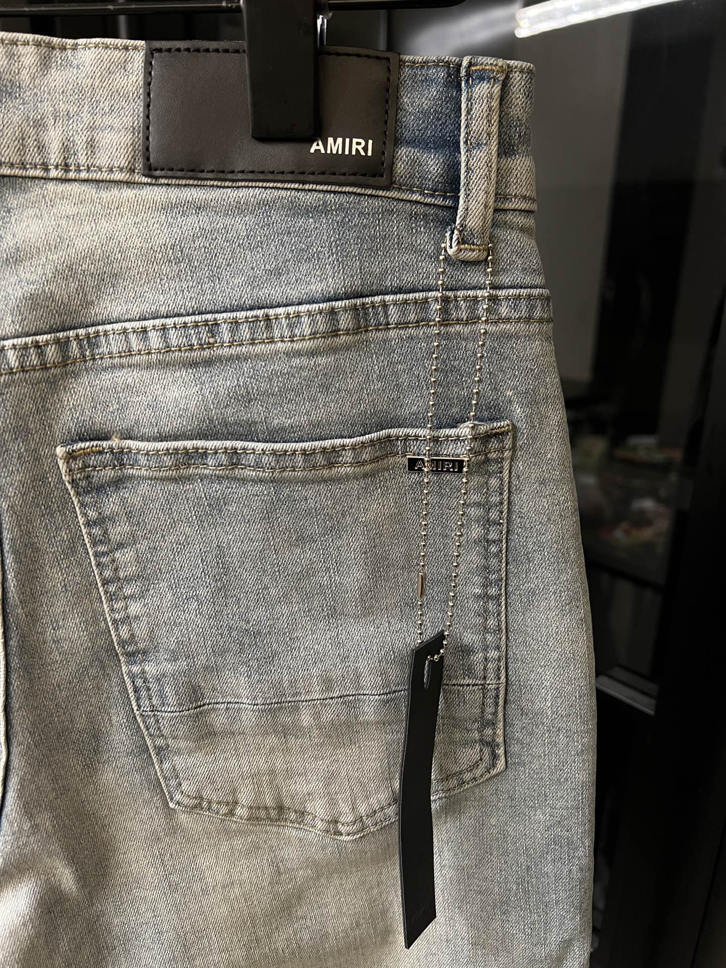 Amiri light-wash jeans with front patch pocket and stitched coin pocket