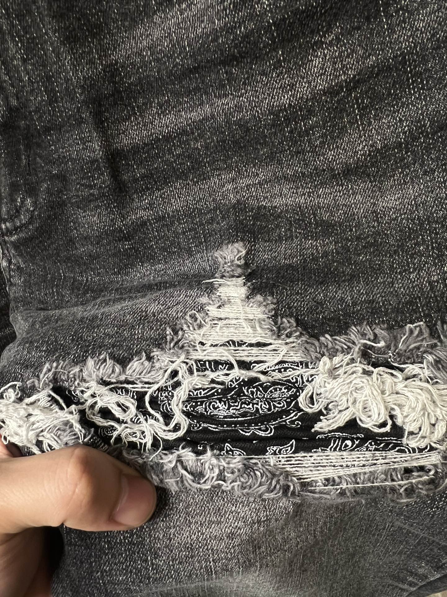 Gray denim cuff with frayed embroidered-look tear detail