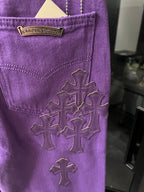 Purple pants with embroidered cross patches on pocket and side seam