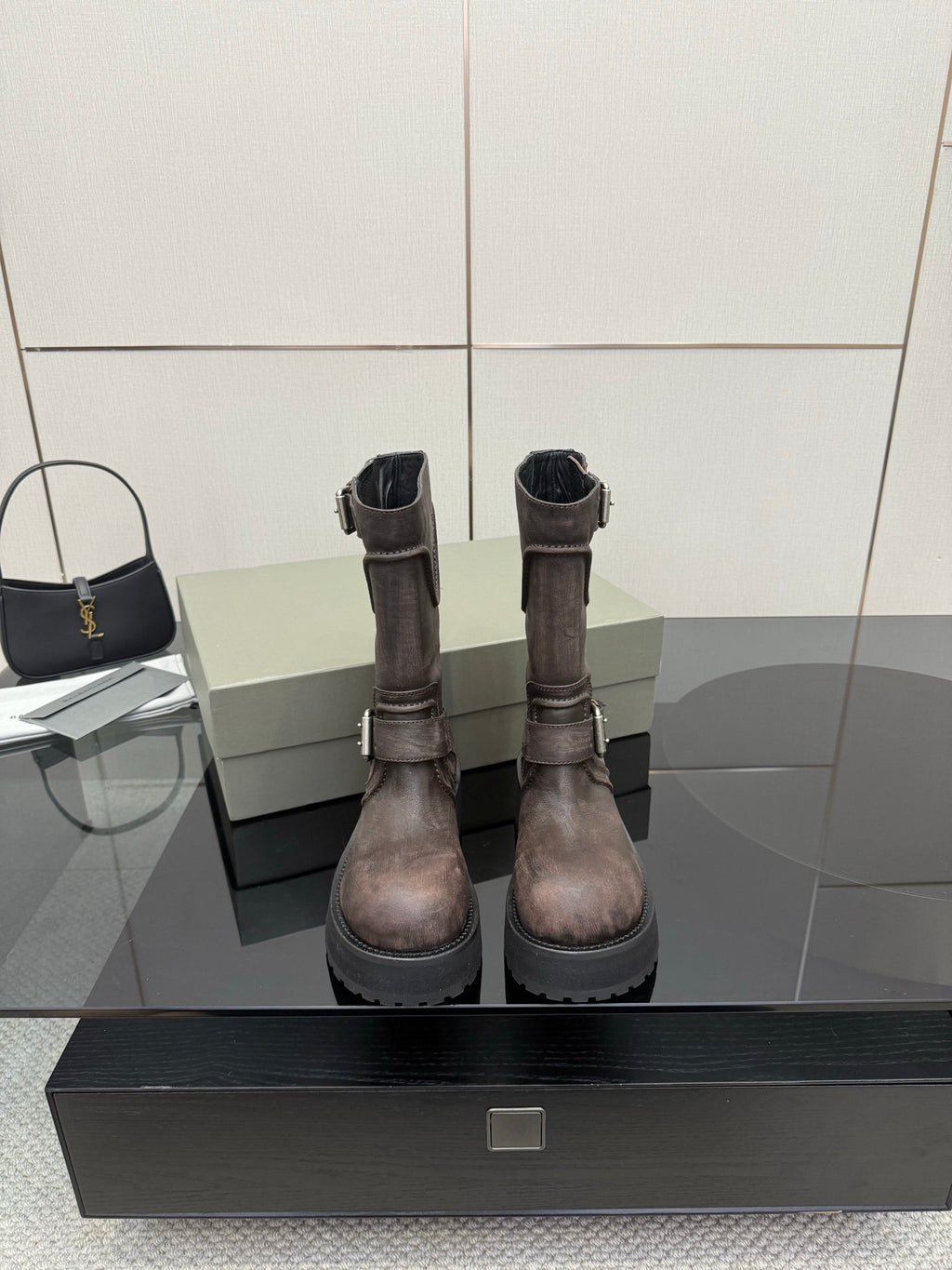 Balenciaga women’s mid-calf leather boots with side zipper, buckle straps, lug sole