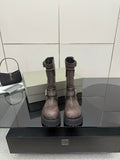 Balenciaga women’s mid-calf leather boots with side zipper, buckle straps, lug sole