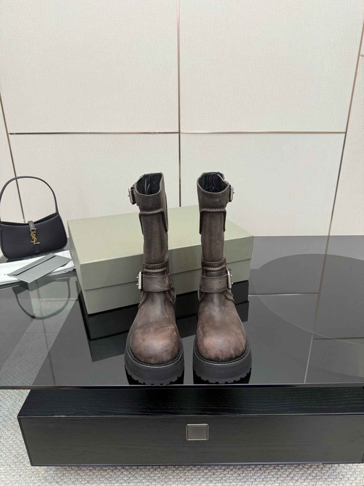 Balenciaga women’s mid-calf leather boots with side zipper, buckle straps, lug sole