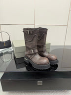 Balenciaga women’s mid-calf leather boots with double buckles and thick lug sole