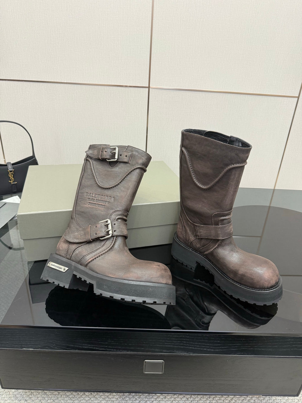 Balenciaga women’s mid-calf leather boots with two buckles and chunky rubber sole