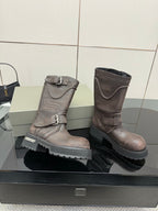 Balenciaga women’s mid-calf leather boots with two buckles and chunky rubber sole