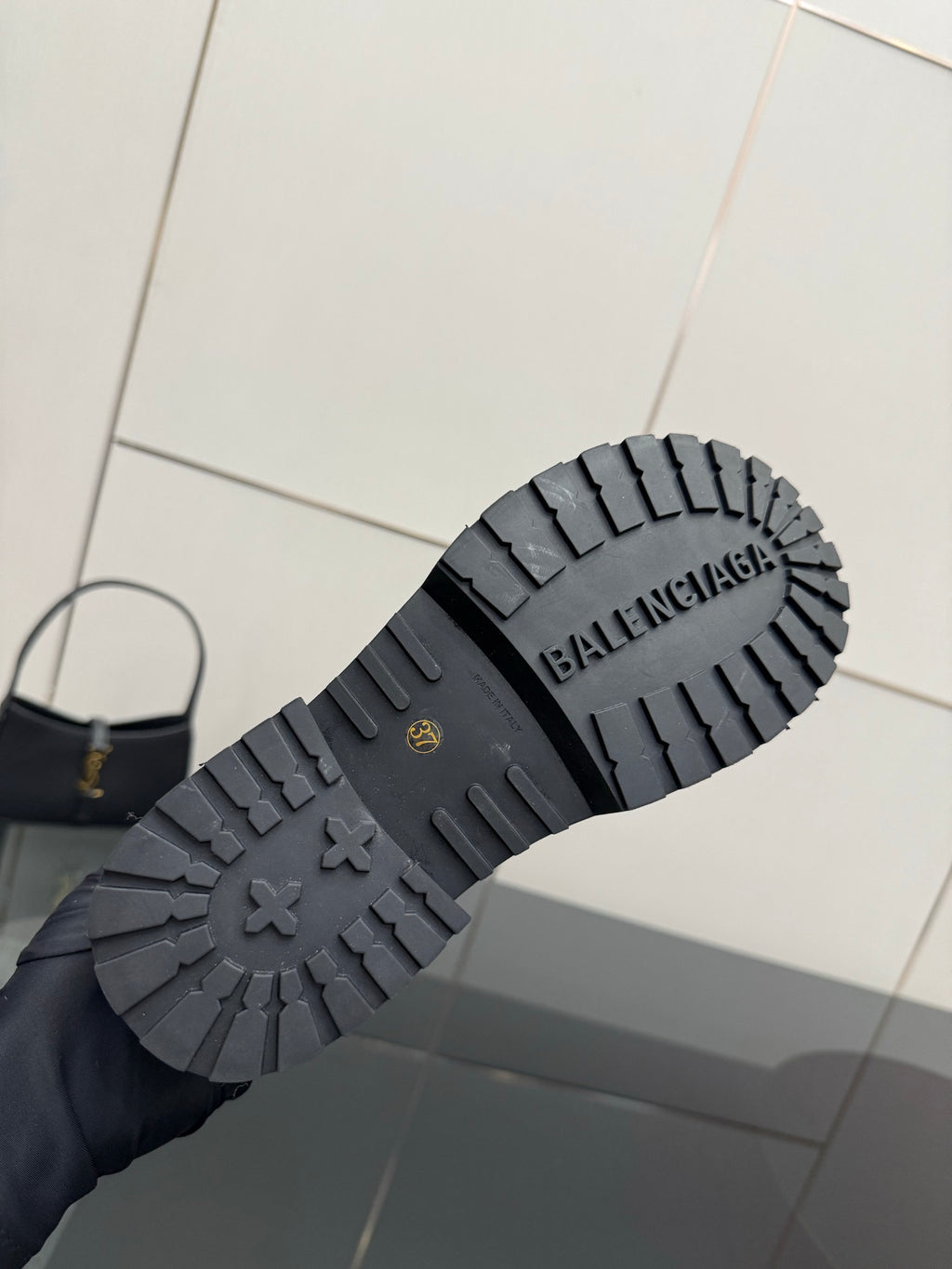 Black rubber lug outsole with Balenciaga branding and traction tread