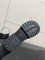 Black rubber lug outsole with Balenciaga branding and traction tread