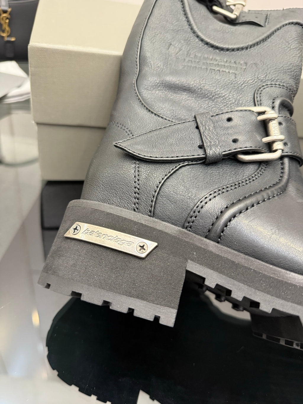 Gray leather boot upper with logo patch and lace-up eyelets