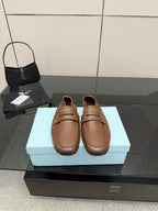 Prada ladies leather loafers, tan brown slip-on with top strap and stitched detail