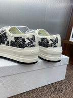 Unisex Dior sneakers, heel with 'CD' detail, white canvas and black palm-print uppers