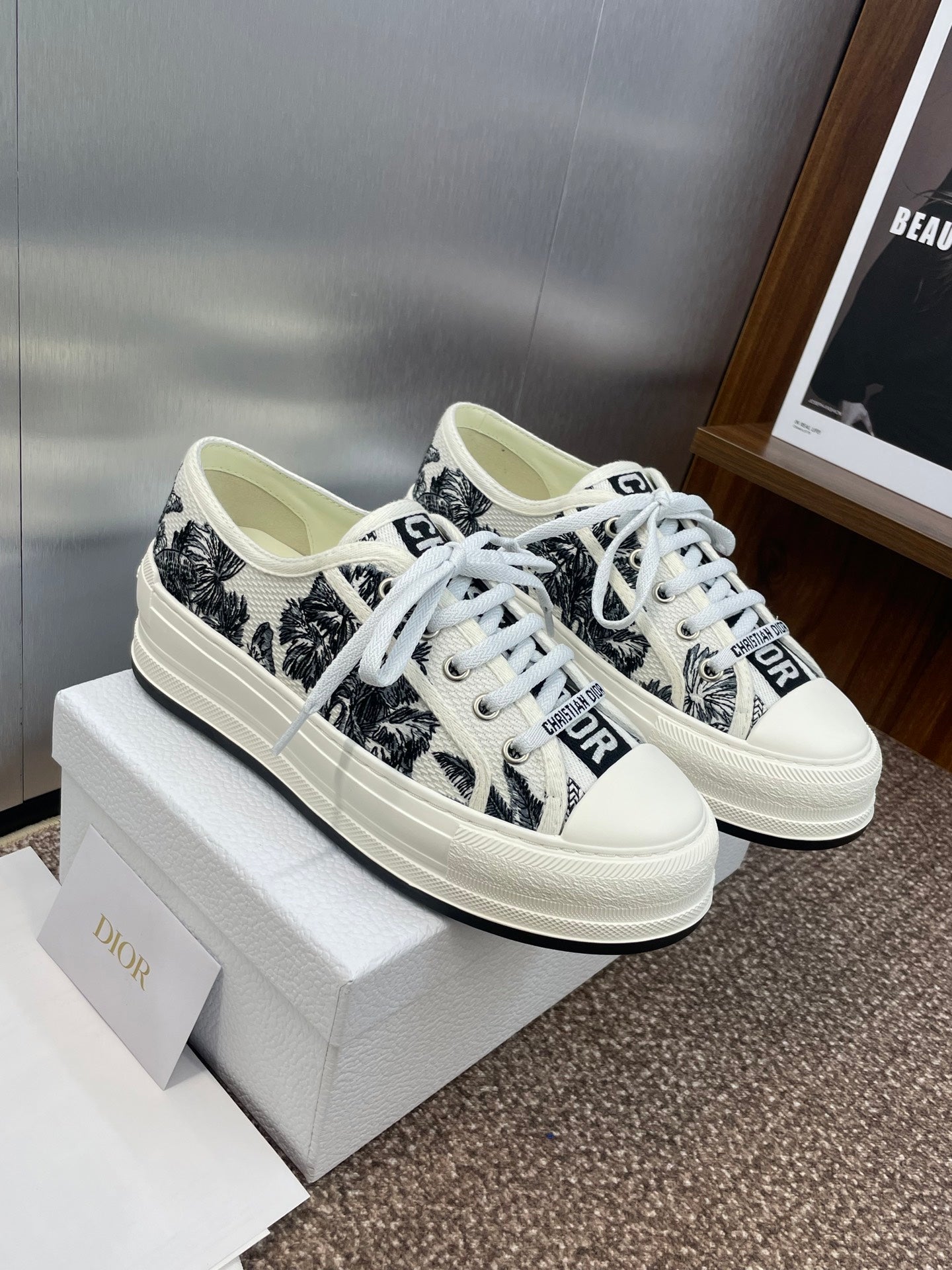 Unisex Dior sneakers with white trim, black palm-print uppers and lace-up design