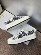 Unisex Dior sneakers, black palm-print canvas, white laces and platform-style rubber sole