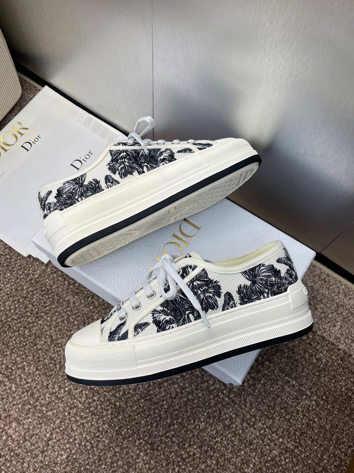 Unisex Dior sneakers, black palm-print canvas, white laces and platform-style rubber sole