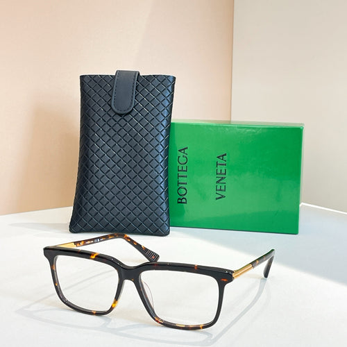 Bottega Veneta glasses with dark navy frame, gold temples, clear lenses, in leather case