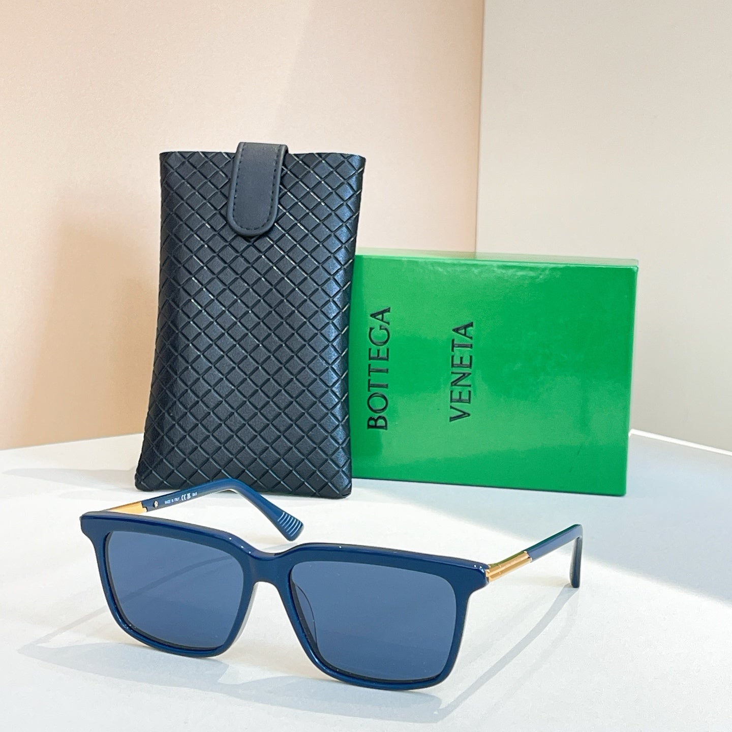 Bottega Veneta glasses with blue frame, blue tinted lenses, gold temples, in leather case
