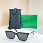 Bottega Veneta glasses with dark frame, dark lenses, gold temples, in leather case
