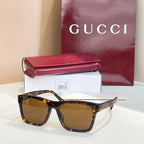 Tortoiseshell square sunglasses with amber-brown tinted lenses and glossy acetate frame.