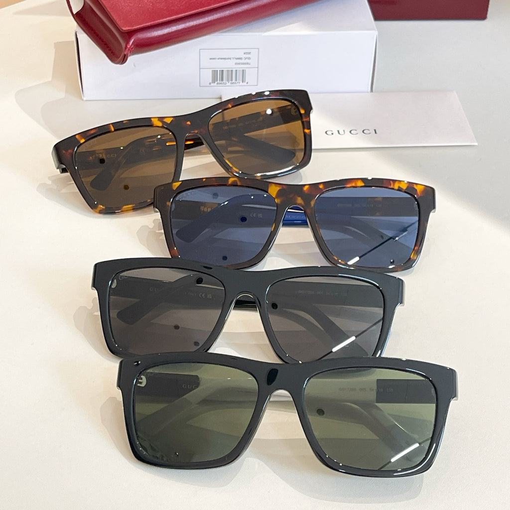 Assorted square sunglasses with tortoiseshell, dark blue, and black frames and tinted lenses.