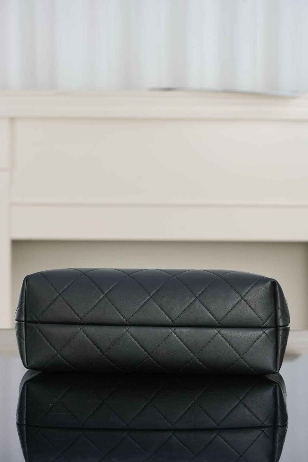Chanel quilted black bag base with diamond stitch pattern