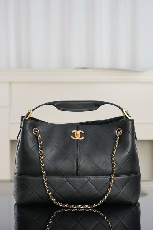 Chanel quilted shoulder bag, dark leather with gold chain handle and CC logo