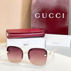 Gucci sunglasses with brown frame, rose-tinted gradient lenses, gold accents