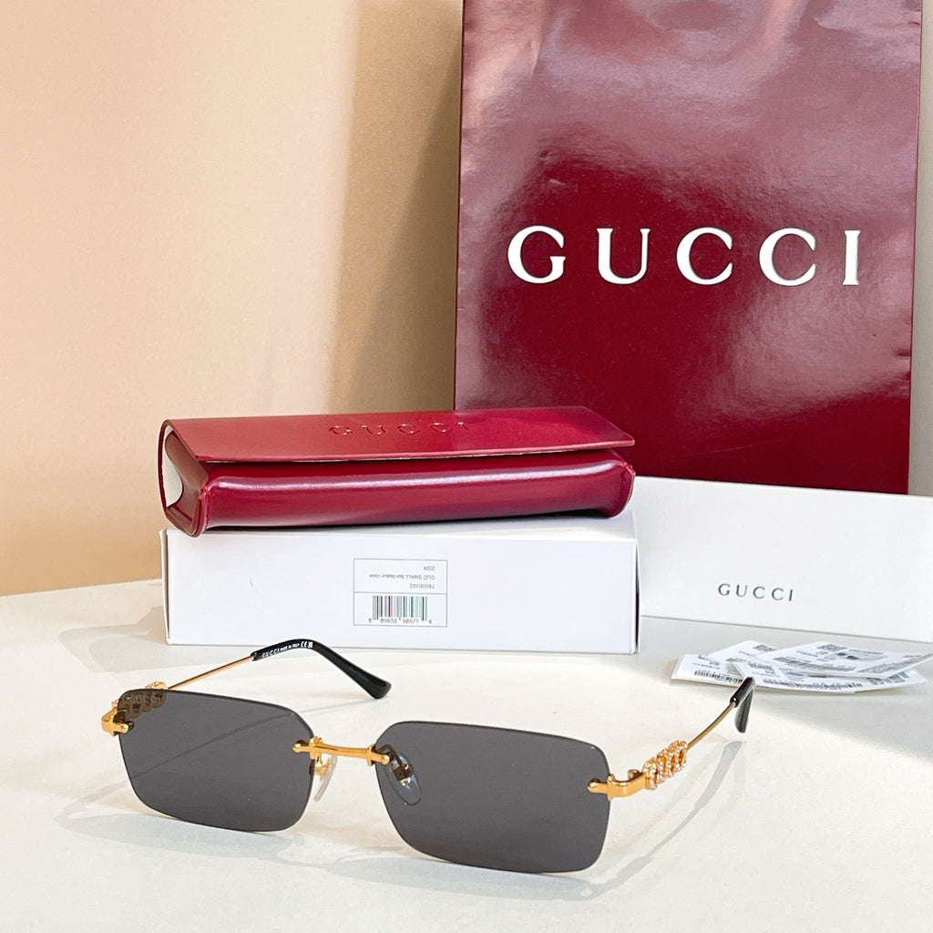 Gucci square sunglasses with charcoal lenses and gold-tone embellished frame