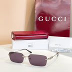 Gucci square sunglasses with dark purple lenses and gold-tone embellished frame