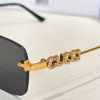 Gucci gold-tone temple with jeweled detail and dark lens