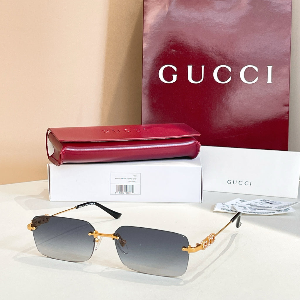 Gucci square sunglasses with slate blue lenses and gold-tone embellished frame