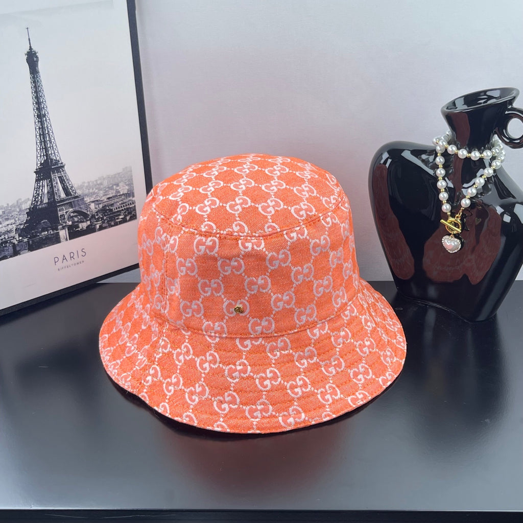Gucci logo bucket hat in orange with white GG pattern
