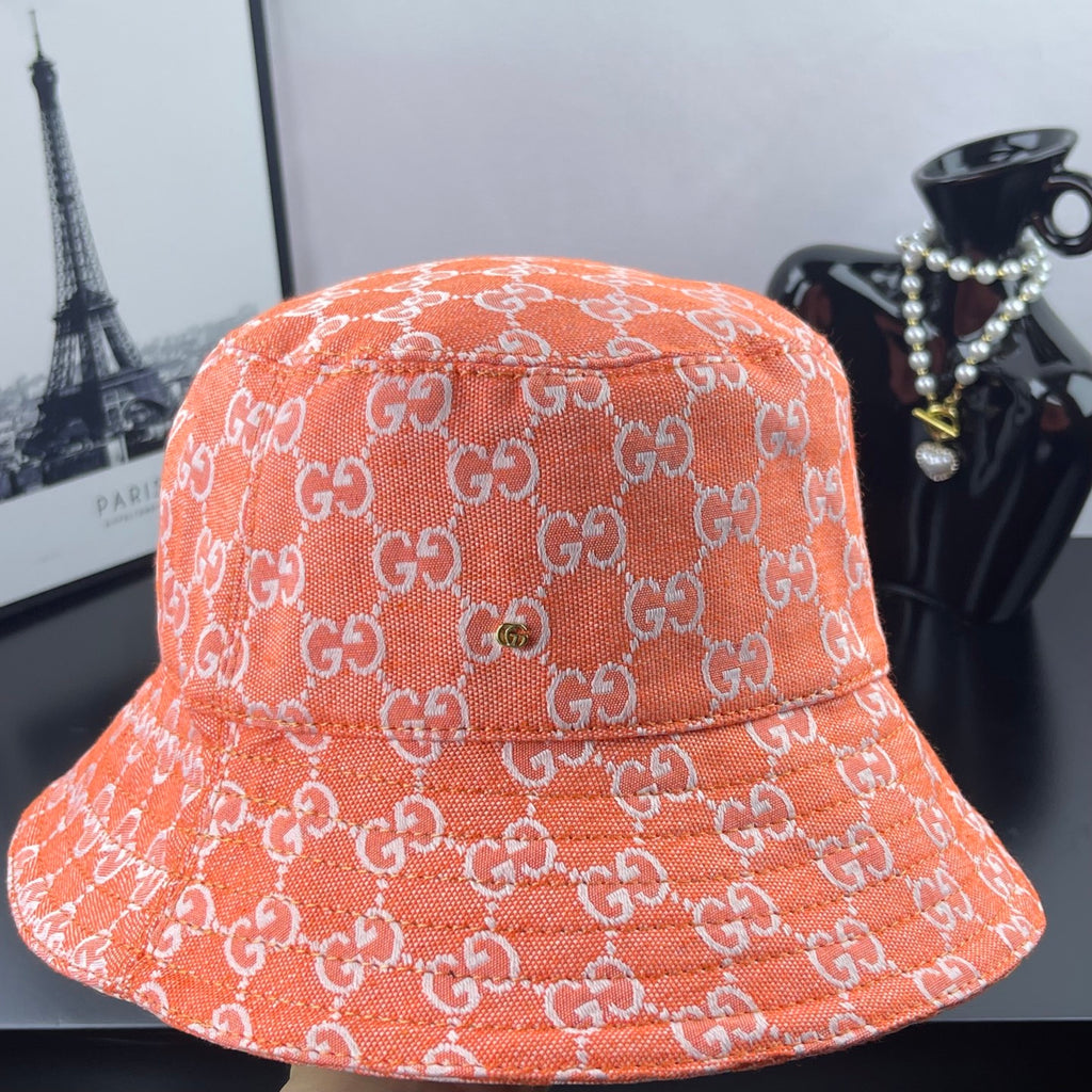 Orange GG-print bucket hat with embroidered logo pattern and wide brim