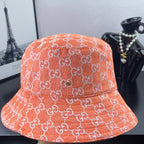 Orange GG-print bucket hat with embroidered logo pattern and wide brim