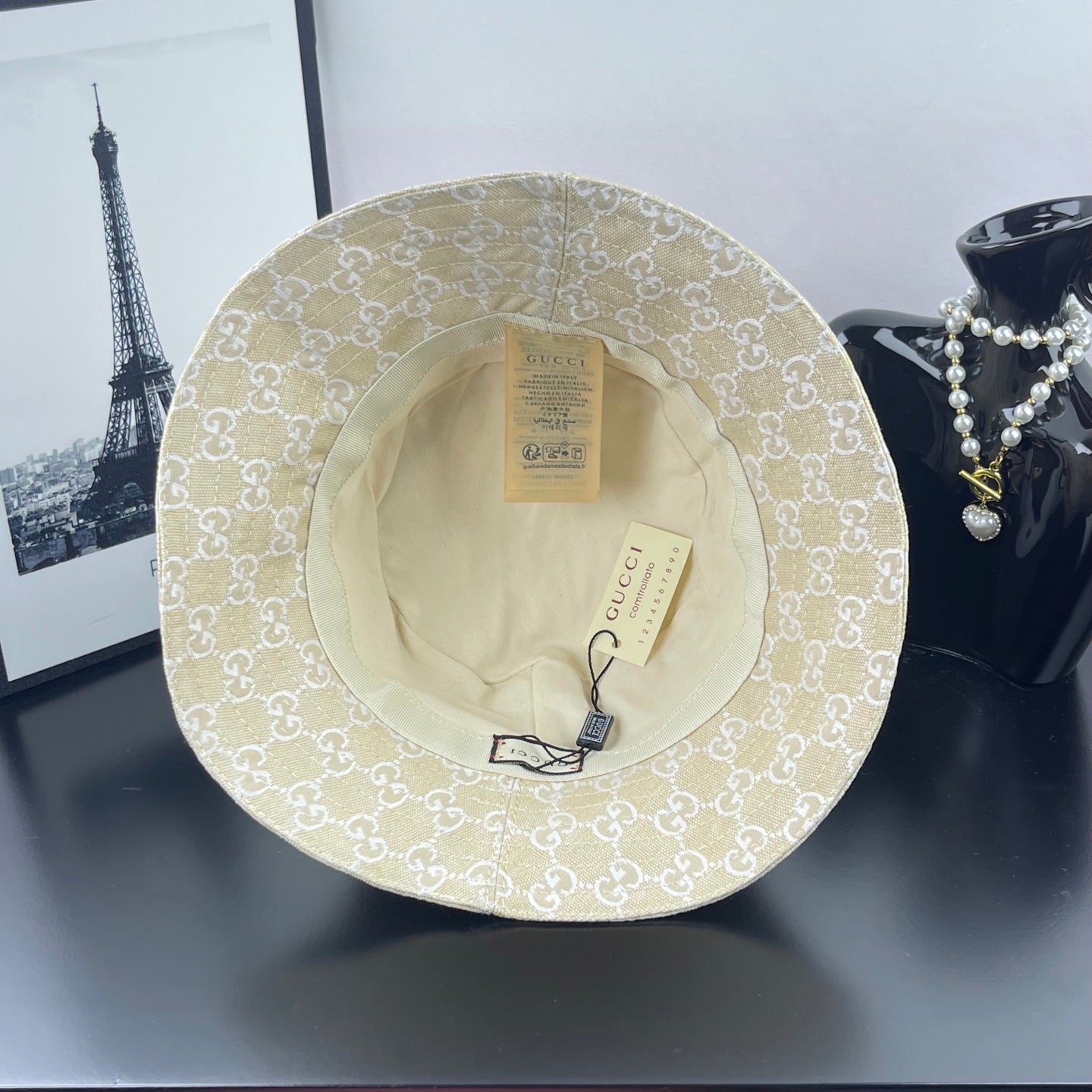 Gucci cap light gold GG monogram, interior lining and tags visible