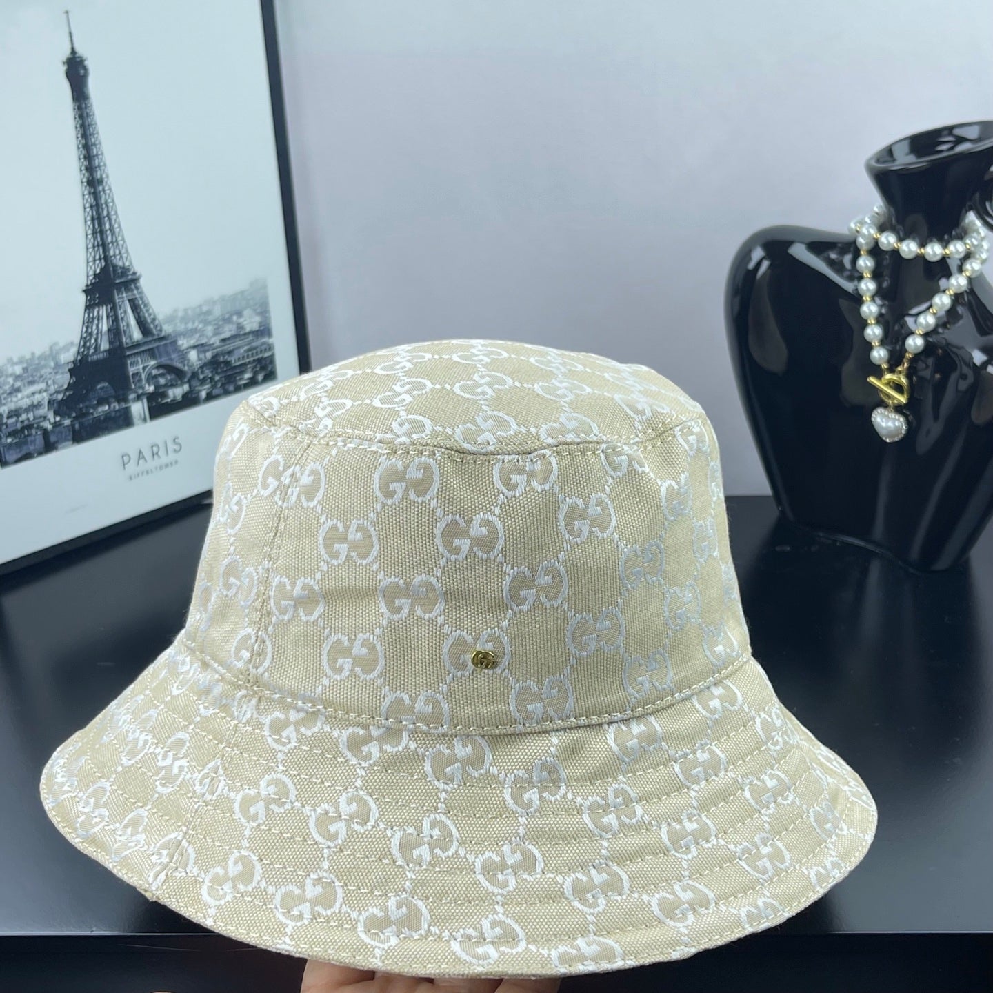 Gucci cap light gold GG monogram, front view with curved crown