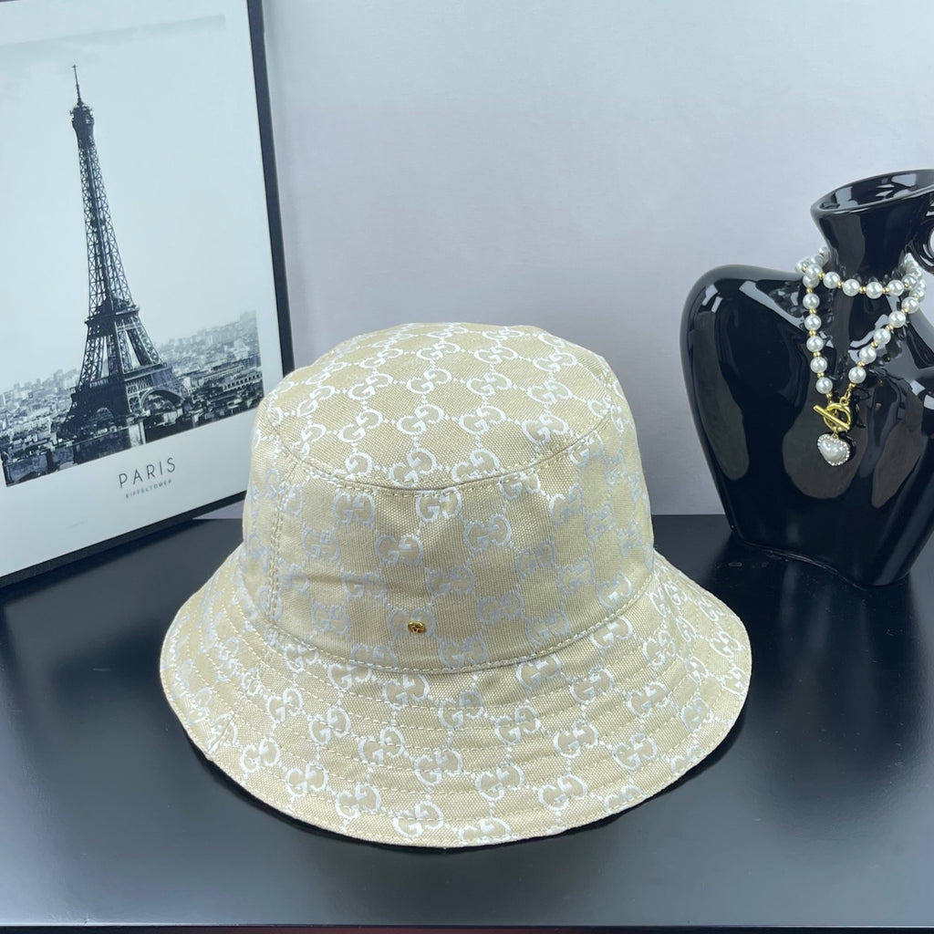 Gucci cap in light gold with allover GG monogram pattern, wide brim