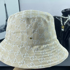 Gucci cap light gold GG monogram, close side view with stitched brim rows