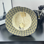 Gucci GG-print bucket cap with visible cream interior and size tag