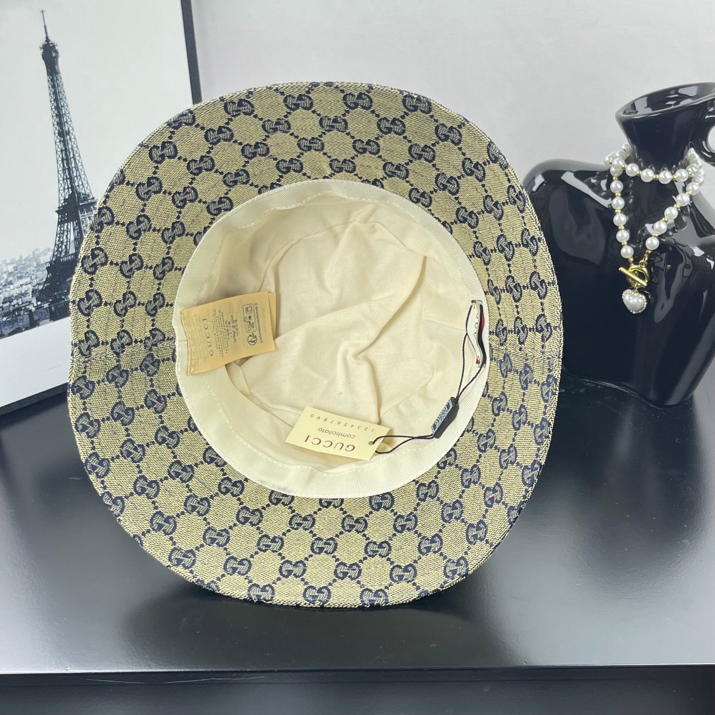 Gucci GG-print bucket cap interior view with tags and cream lining