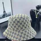 Gucci GG-print bucket cap, light beige with navy logo pattern