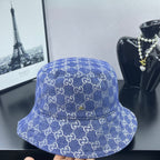 Blue GG monogram bucket cap with center pin detail and curved brim