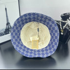 Blue GG monogram bucket cap with beige lining and interior label tags