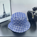 Blue bucket cap with GG monogram pattern, stitched crown and brim