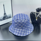 Blue bucket cap with GG monogram pattern, stitched crown and brim