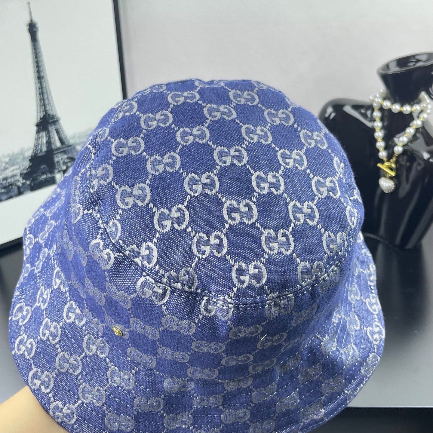 Blue GG monogram bucket cap with textured fabric and stitched panel seams