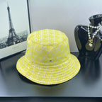 Gucci bucket cap bright yellow with repeating GG monogram pattern and stitched brim