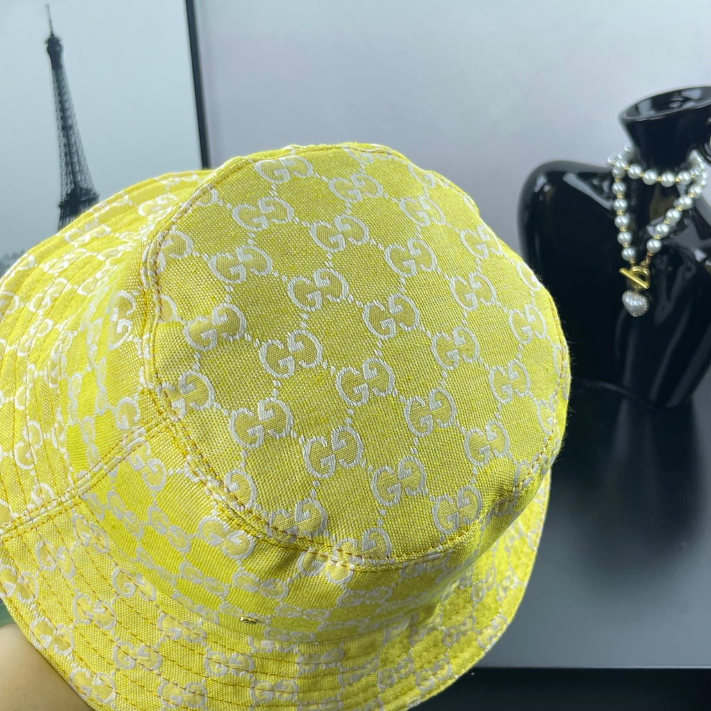 Gucci bucket cap bright yellow with GG monogram fabric and curved side seam