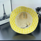 Gucci bucket cap bright yellow with beige lining and Gucci tag inside