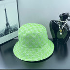 Lime green Gucci bucket hat with GG monogram pattern and soft curved brim